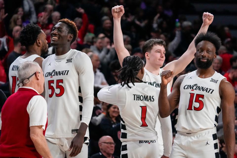 The Cincinnati Bearcats celebrate after an official review confirms the UC win over Kansas State on Saturday, March 2.