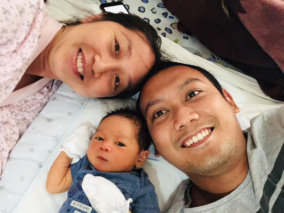 In this family photograph, Eudinson Uy, right, poses for a photograph with his wife, Allaina Pelayo, and their infant son Benjamin Timoteo, in Yerevan, Armenia, July 9, 2020. They are among the hundreds of thousands of foreign residents of the United Arab Emirates who now are stuck abroad amid the coronavirus pandemic. (Eudinson Uy via AP)