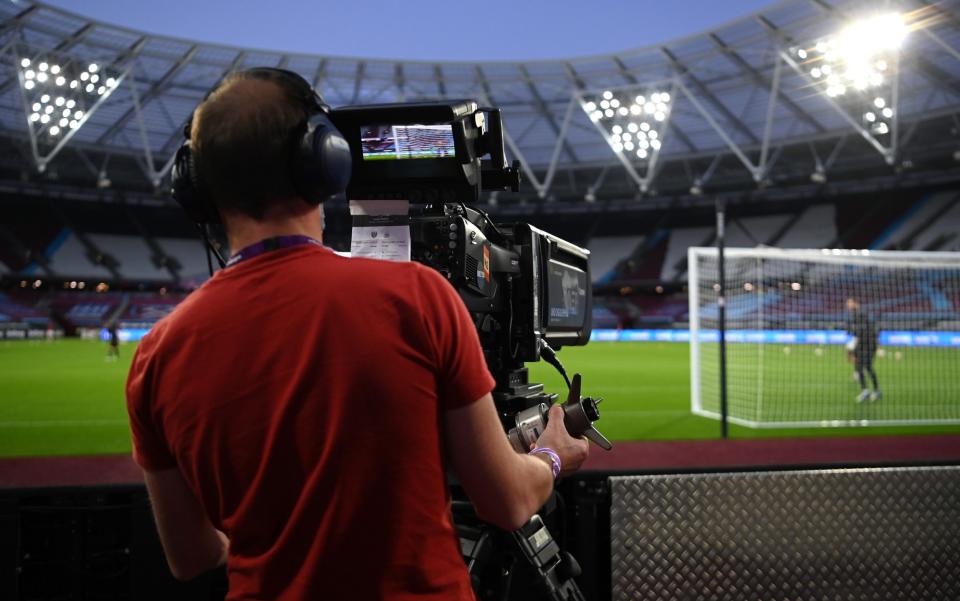 A TV Camera man films the warm-up prior to the Premier League match between West Ham United and Newcastle United - GETTY IMAGES