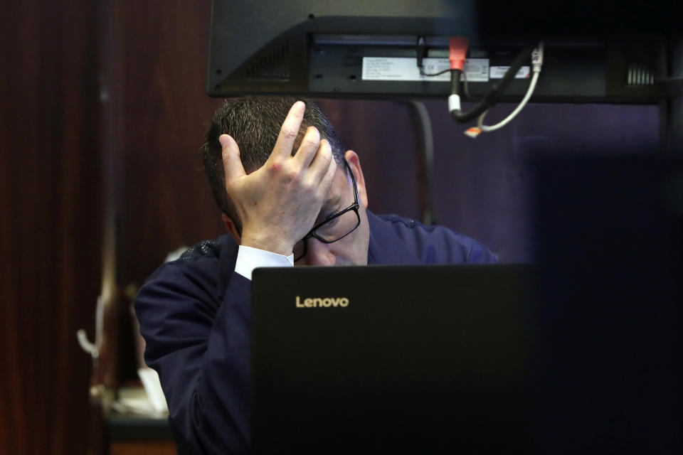 FILE - In this Aug. 12, 2019, file photo trader David Fox works on the floor of the New York Stock Exchange. Stocks of companies that do lots of business with China are obvious targets to sell when trade worries rise, and they’ve lagged sharply behind the rest of the market whenever President Donald Trump sends out a tariff tweet. But investors are also looking way beyond these first-order effects, as they pick out which stocks look most vulnerable to the trade war. (AP Photo/Richard Drew, File)