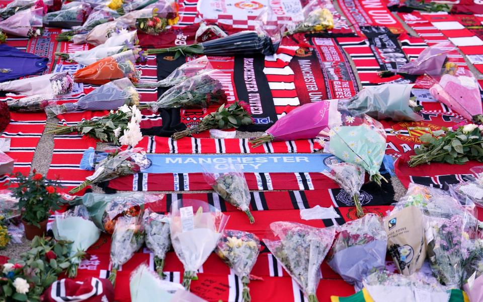 A sea of scarves and bouquets