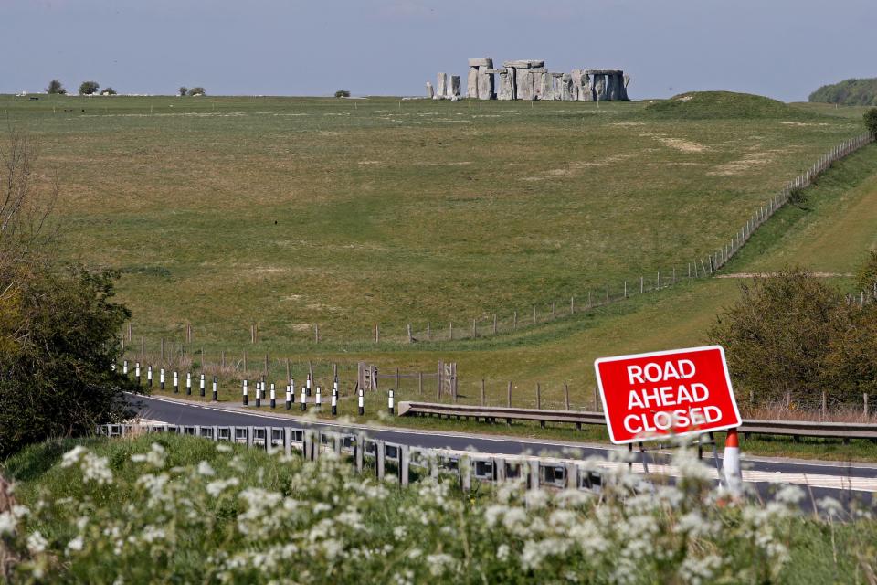 A sign warns of a road closure on the route to the prehistoric monument at Stonehenge in southern England, on April 26, 2020, closed during the national lockdown due to the novel coronavirus COVID-19 pandemic. - Britain's health ministry on Saturday said 813 more people had died after testing positive for COVID-19 in hospital, taking the death toll to 20,319. (Photo by Adrian DENNIS / AFP) (Photo by ADRIAN DENNIS/AFP via Getty Images)