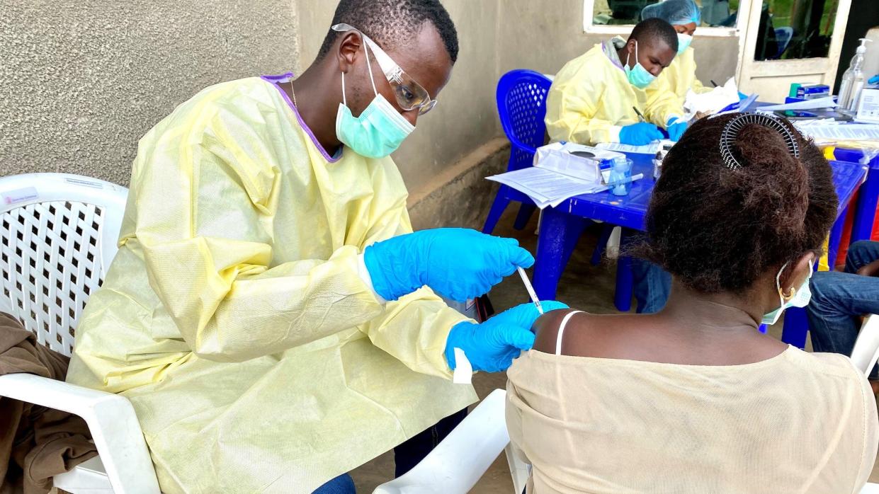 File photo taken on March 21, 2021 shows a medical worker vaccinating a local resident against the Ebola virus in North Kivu province, northeastern Democratic Republic of the Congo.