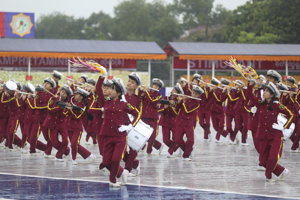 A marching band of state students perform during a destruction ceremony of seized illegal narcotics, marking International Day against Drug Abuse and Illicit Trafficking on the outskirts of Yangon, Myanmar, Monday, June 26, 2023.(AP Photo/Thein Zaw)