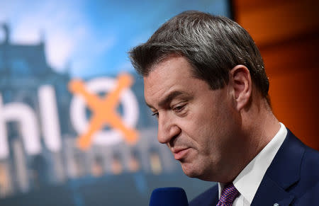 Bavarian State Prime Minister and Christian Social Union (CSU) top candidate Markus Soeder takes part in an interview at a TV studio following the Bavarian state election in Munich, Germany, October 14, 2018. Peter Kneffel/Pool via Reuters