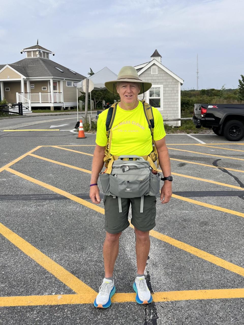 Tim Duffy, of Ogunquit, Maine, is seen Aug. 21, 2023, at Seagull Beach in Massachusetts, ready to go on the first day of his walk to raise funds and awareness for the fight against pancreatic cancer. His wife, Kate, who battled the disease, died in 2022.
