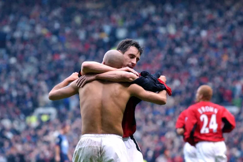 Gary Neville celebrates with Veron after his goal against Arsenal at Old Trafford in December 2002.