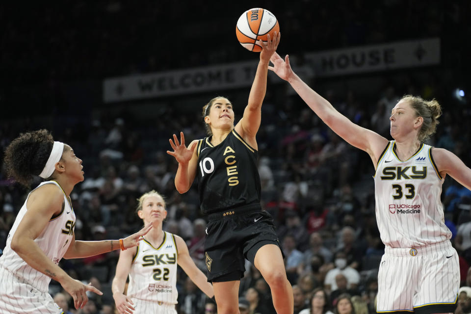 Las Vegas Aces guard Kelsey Plum (10) shoots against Chicago Sky forward Emma Meesseman (33) during the second half of a WNBA basketball game Tuesday, June 21, 2022, in Las Vegas. (AP Photo/John Locher)