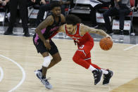 Ohio State's Duane Washington, right, dribbles the ball up court against Penn State's Jamari Wheeler during the second half of an NCAA college basketball game Wednesday, Jan. 27, 2021, in Columbus, Ohio. Ohio State beat Penn State 83-79. (AP Photo/Jay LaPrete)