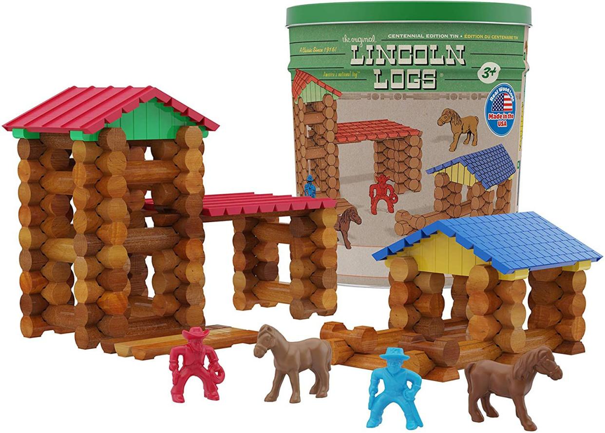 Lincoln Logs tin with two cowboys and two brown horses.