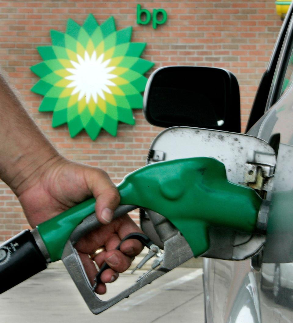 ** FILE **A man pumps gas at a BP station in Bainbridge Twp., Ohio in a file photo from Aug. 7, 2006. BP PLC, Europe's second-largest oil company, reported a 17 percent drop in first-quarter earnings Tuesday, April 24, 2007 on lower oil prices and declining production. (AP Photo/Amy Sancetta, File)