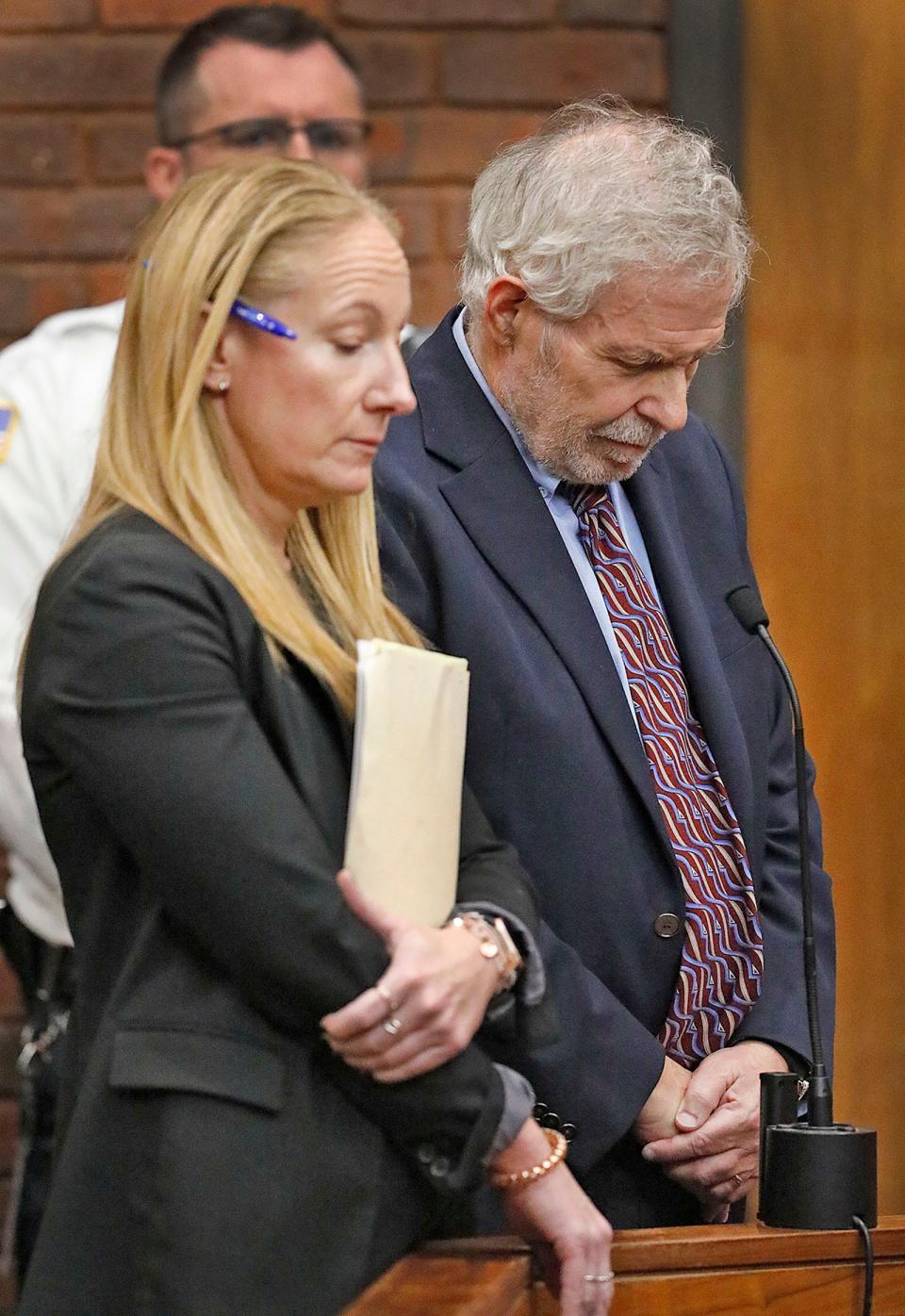 Defense attorney Kelli Porges, left, and her client, Norwell pediatrician Dr. Richard Kauff, listen to the charges during his arraignment in Hingham District Court on Monday, Nov. 20, 2023, on charges of sexual assault as a result of complaints from former patients.