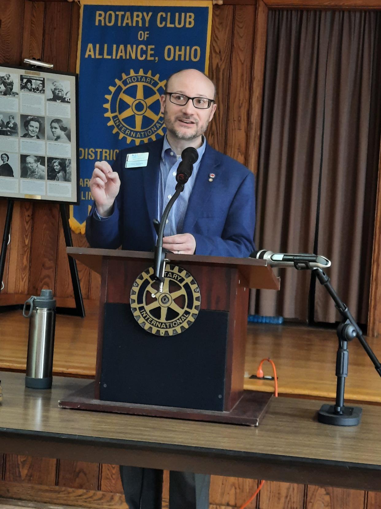 Rodman Public Library Director Eric Taggart speaks during the March 23 meeting of Rotary Club of Alliance at the Alliance YWCA.