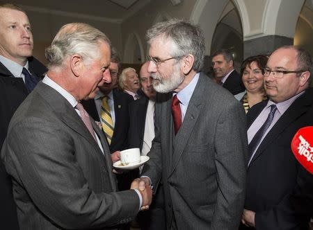 Britain's Prince Charles (L) shakes hands with Gerry Adams at the National University of Ireland in Galway, Ireland May 19, 2015. REUTERS/Adam Gerrard/pool