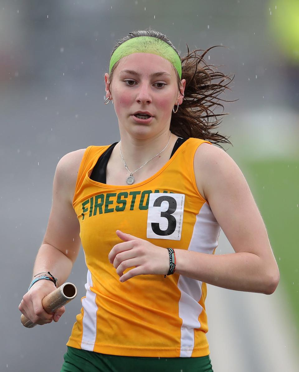 Firestone's Sarah Schueler competes in the girls 3,200-meter relay during the City Series track meet at Ellet High School on Saturday.