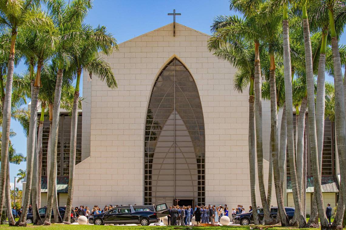 People are seen wearing blue after Lucy Fernandez’s funeral Mass at the Church of the Epiphany on Monday, Sept. 12, 2022.