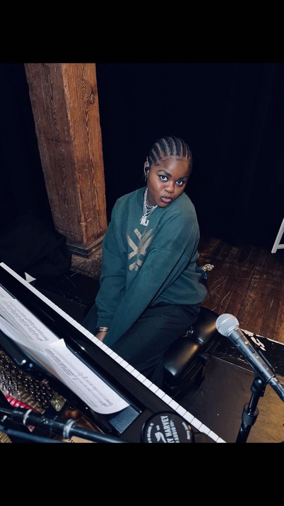 Madonna’s daughter Mercy James could be seen sat by a piano for another frame (Madonna Instagram)