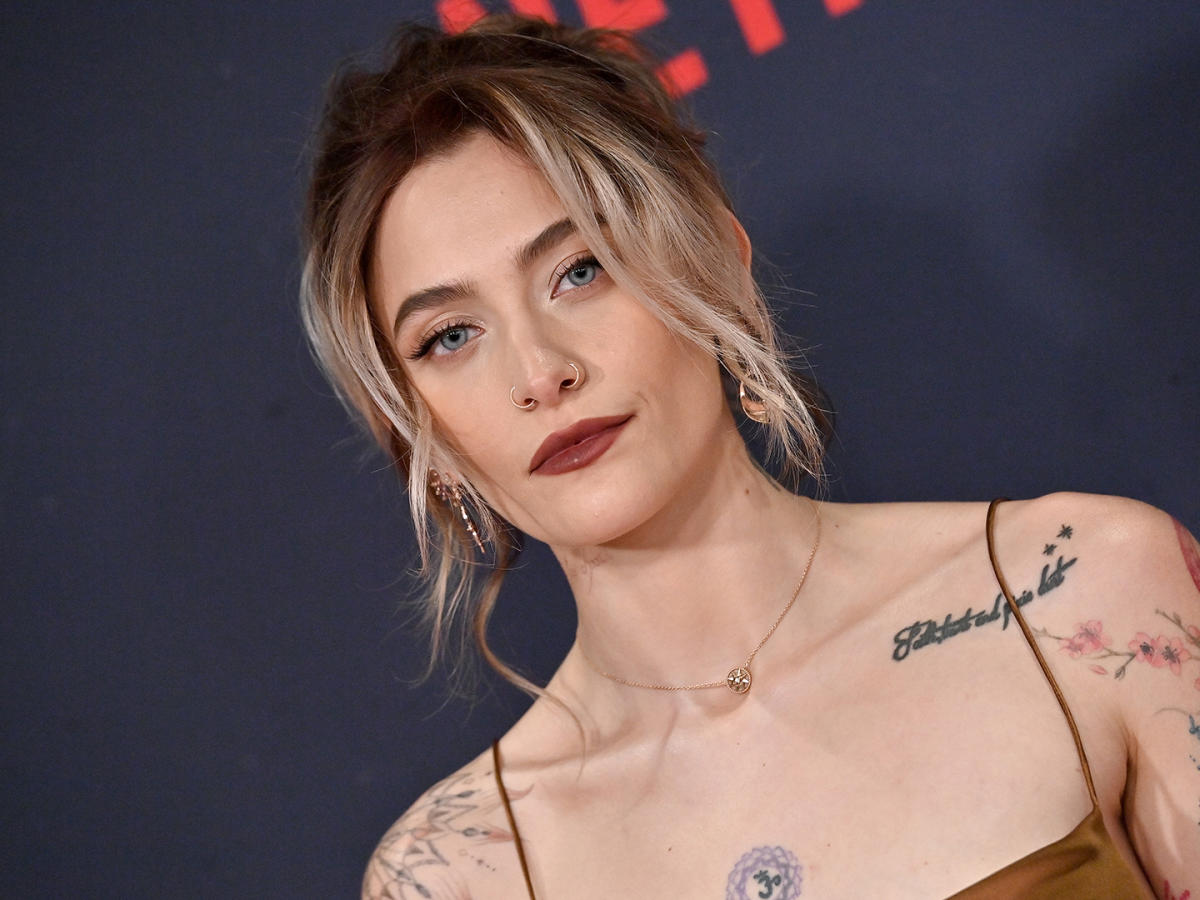 Paris Jackson exposes her eclectic tattoos in plunging backless