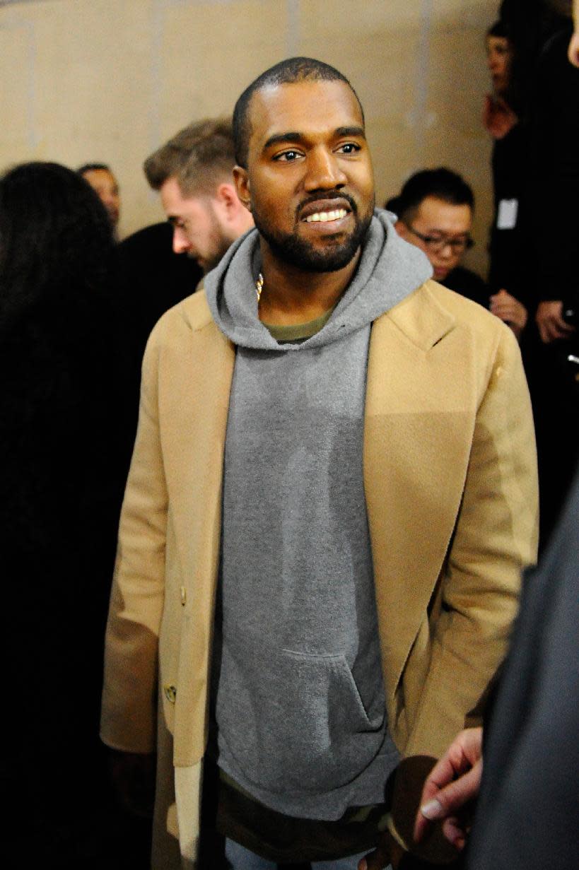 FILE - In this Jan. 19, 2014 file photo, singer Kanye West attends the Y-3 men's Fall-Winter 2014-2015 fashion collection, in Paris. West and Jay Z joined forces Wednesday night, March 12, 2014, during SXSW in Austin, Texas. (AP Photo/Zacharie Scheurer, file)