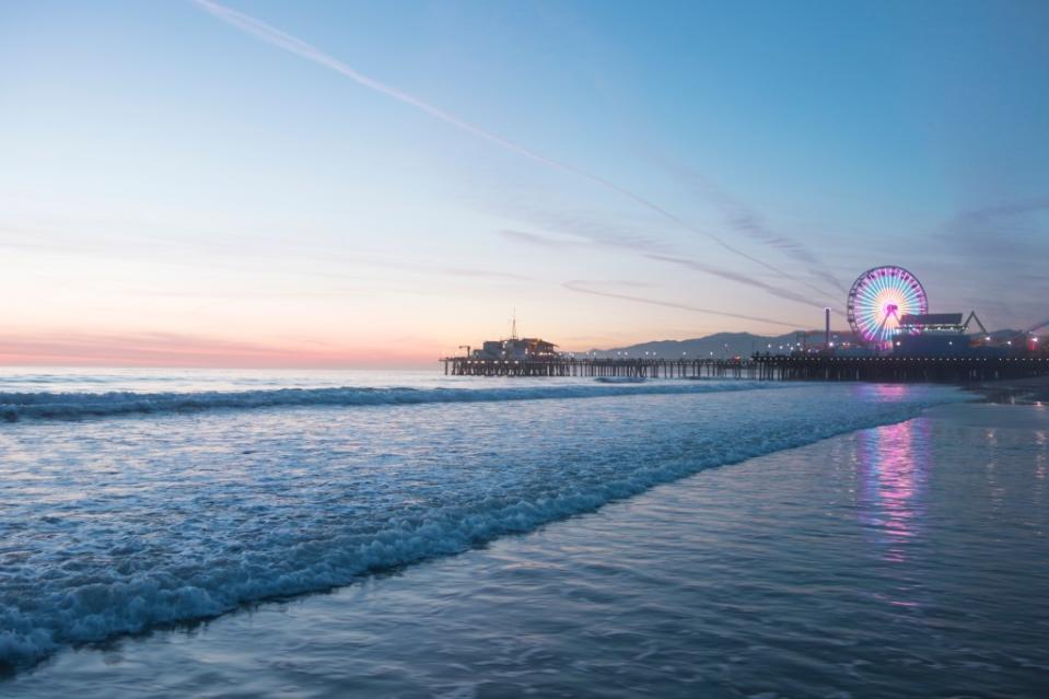 Santa Monica Pier Beach at Sunset via Getty Images