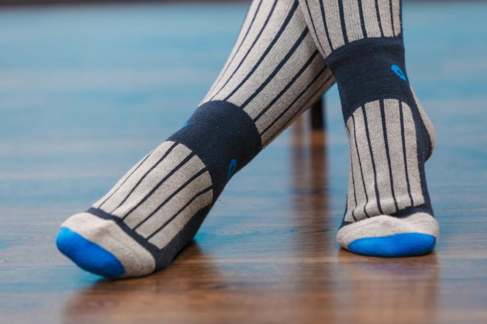 Wearing compression socks could help you stop snoring at night, according to one expert. Getty Images/iStockphoto