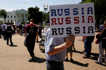 FILE PHOTO - Protesters gather to rally against U.S. President Donald Trump's firing of Federal Bureau of Investigation (FBI) Director James Comey, outside the White House in Washington, U.S. May 10, 2017. REUTERS/Jonathan Ernst/File Photo