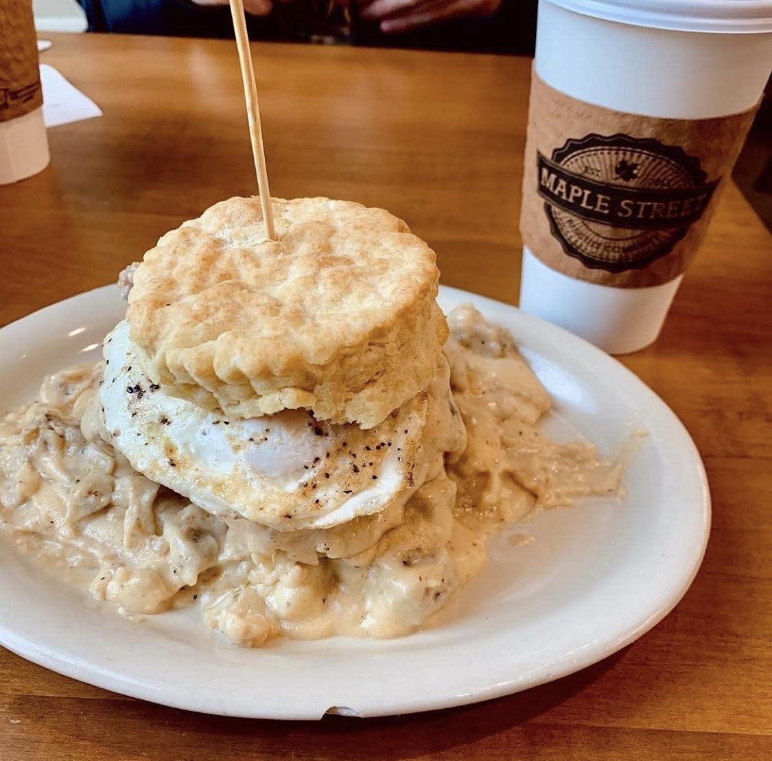 A &ldquo;Five and Dime&rdquo; biscuit from Maple Street Biscuit Company, topped with fried chicken, a fried egg, pecanwood smoked bacon, cheddar cheese and house-made gravy.