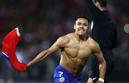 Chile's Alexis Sanchez celebrates after scoring the winning penalty kick in their Copa America 2015 final soccer match against Argentina at the National Stadium in Santiago, Chile, July 4, 2015. REUTERS/Marcos Brindicci