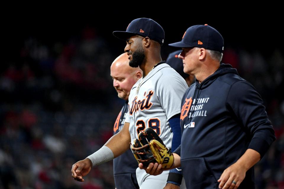 Detroit Tigers third baseman Niko Goodrum (28) is looked at by the team trainer during the sixth inning against the Los Angeles Angels at Angel Stadium, June 18, 2021.