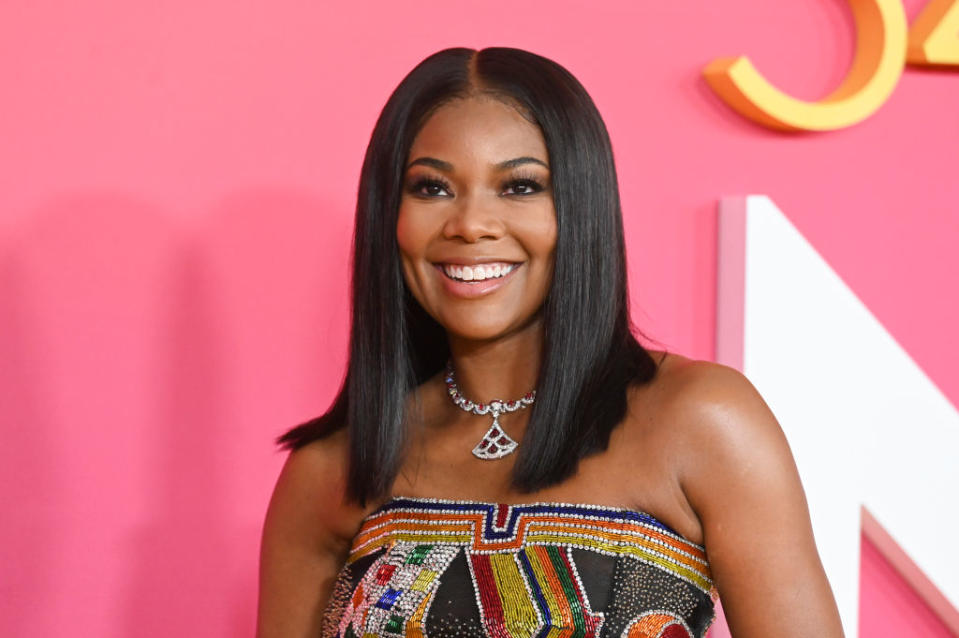 Close-up of Gabrielle smiling at a media event