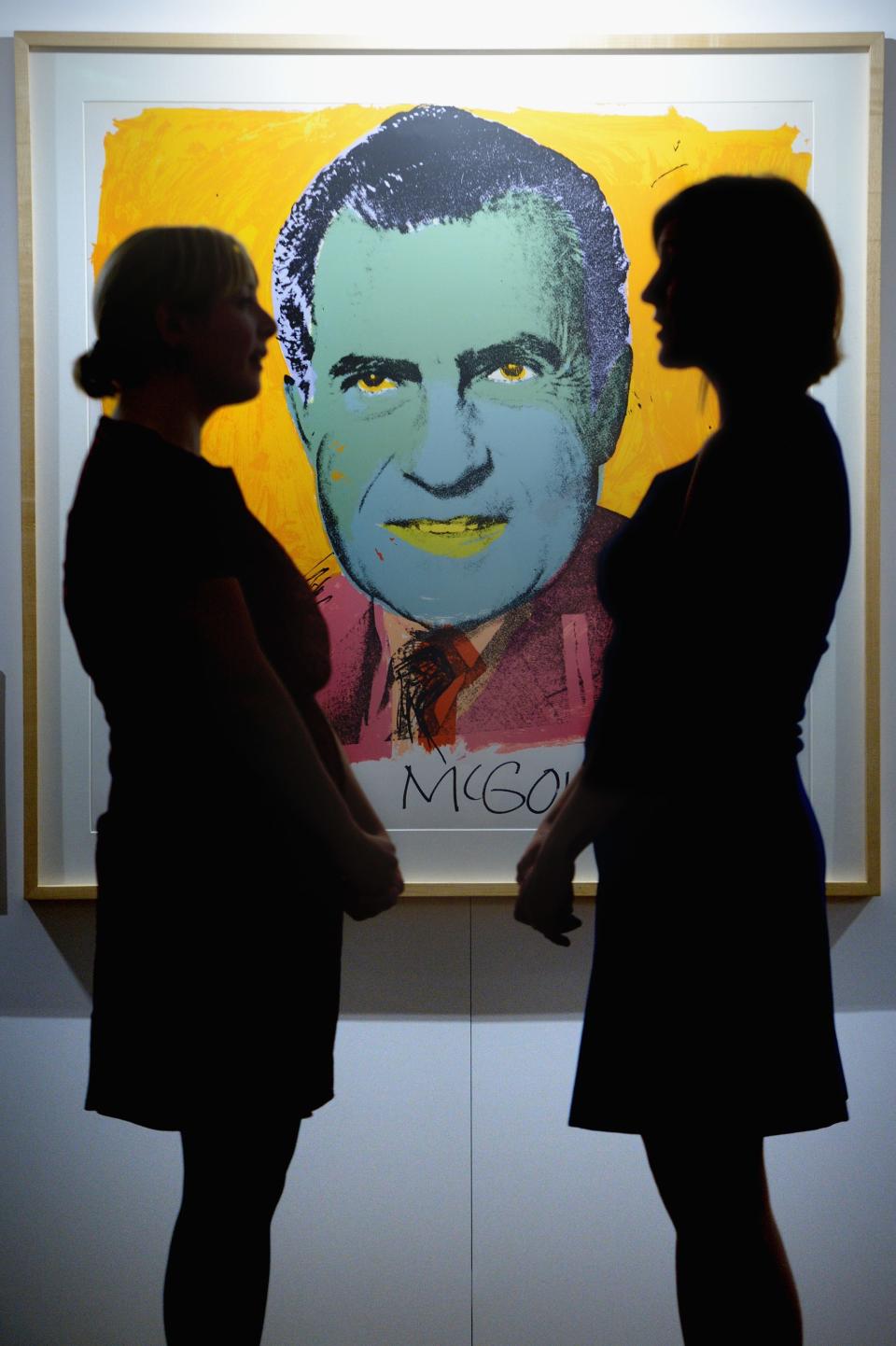 Parliament staff view the work of Andy Warhol at the Pop, Power and Politics exhibition at the Scottish Parliament on October 10, 2013 in Edinburgh, Scotland.