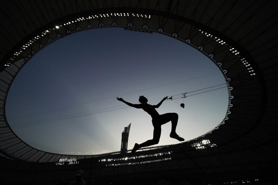 An athlete competes during the qualifications for the men's long jump event at the World Athletics Championships in Doha, Qatar, Friday, Sept. 27, 2019. (AP Photo/David J. Phillip)
