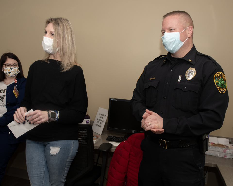 Rebecca Schneider, a Kent police and fire dispatcher, and Kent Police Lt. Mike Lewis were at UH Portage Medical Center's Seidman Medical Center Wednesday morning to present checks, a part of the approximately $3,000 the police department raised in recent months to help local cancer patients.