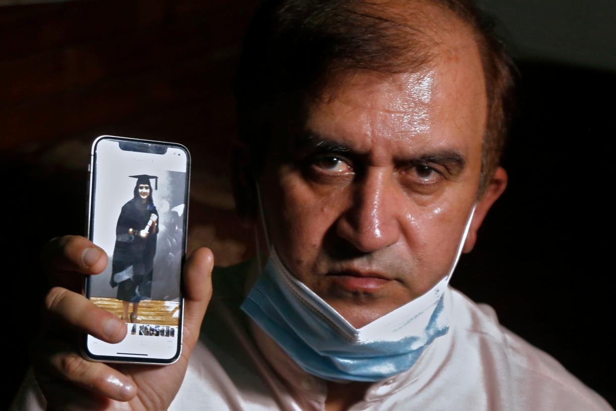 <p>File image: An image of Mayra Zulfiqar, a British woman of Pakistani origin who was found dead at a home, is displayed by her father Muhammad Zulfiqar on his mobile phone in Lahore, Pakistan, on 20 May, 2021</p> (AP)