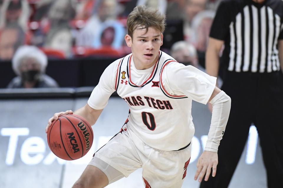 Texas Tech's Mac McClung (0) controls the ball during the first half of an NCAA college basketball game against Iowa State in Lubbock, Texas, Thursday, March 4, 2021. (AP Photo/Justin Rex)