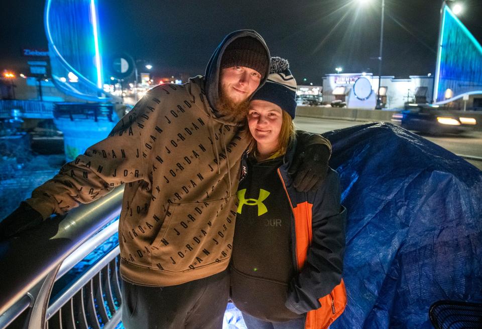David Koukoulis and Samantha Olney often sleep in a tent on the Kenneth F. Burns Memorial Bridge over Lake Quinsigamond.