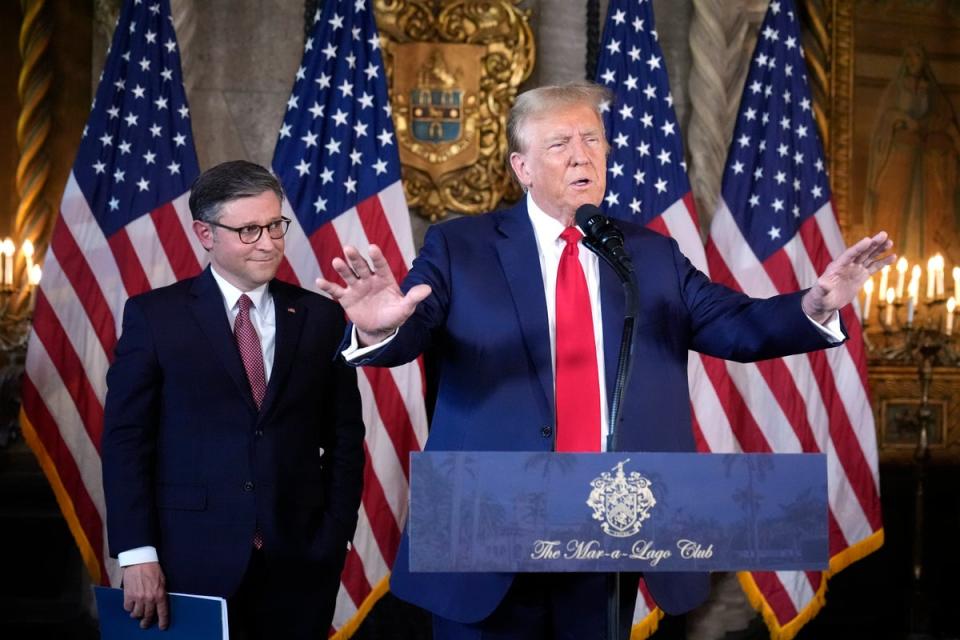 Donald Trumps speaks at Mar-a-Lago on 12 April with House Speaker Mike Johnson. (AP)