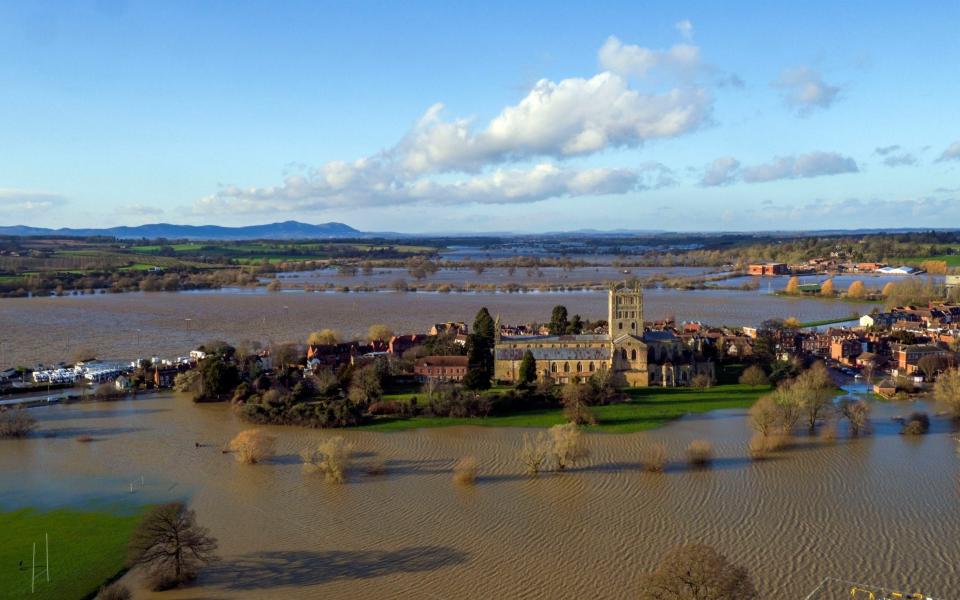 Flood water continues to surround Tewkesbury Abbey, Gloucestershire, in the aftermath of Storm Dennis - PA
