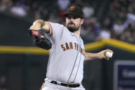 San Francisco Giants pitcher Carlos Rodon throws to an Arizona Diamondbacks batter during the first inning of a baseball game Friday, Sept. 23, 2022, in Phoenix. (AP Photo/Rick Scuteri)