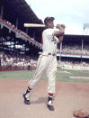 FILE- In this 1954 file photo, Milwaukee Braves' Hank Aaron poses for a photo at Ebbets Field during an exhibition season in New York. Hank Aaron, who endured racist threats with stoic dignity during his pursuit of Babe Ruth but went on to break the career home run record in the pre-steroids era, died early Friday, Jan. 22, 2021. He was 86. The Atlanta Braves said Aaron died peacefully in his sleep. No cause of death was given. (AP Photo, File)