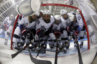 <p>Players from the United States gather in front of the goal before the preliminary round of the womenâs hockey game Finland at the 2018 Winter Olympics in Gangneung, South Korea, Sunday, Feb. 11, 2018. (Ronald Martinez/Pool Photo via AP) </p>