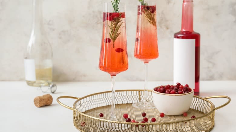 cranberry fizzes in champagne glasses