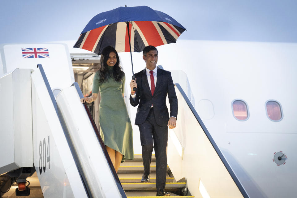 FILE - Britain's Prime Minister Rishi Sunak and his wife Akshata Murty deplane ahead of the G-7 Summit, in Hiroshima, Japan, Thursday, May 18, 2023. (Stefan Rousseau/Pool Photo via AP, File)