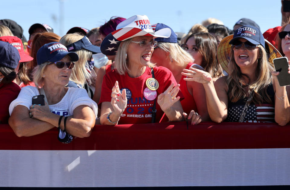 With few face masks and no social distancing, supporters wait for the president at a rally in Arizona. Source: Getty