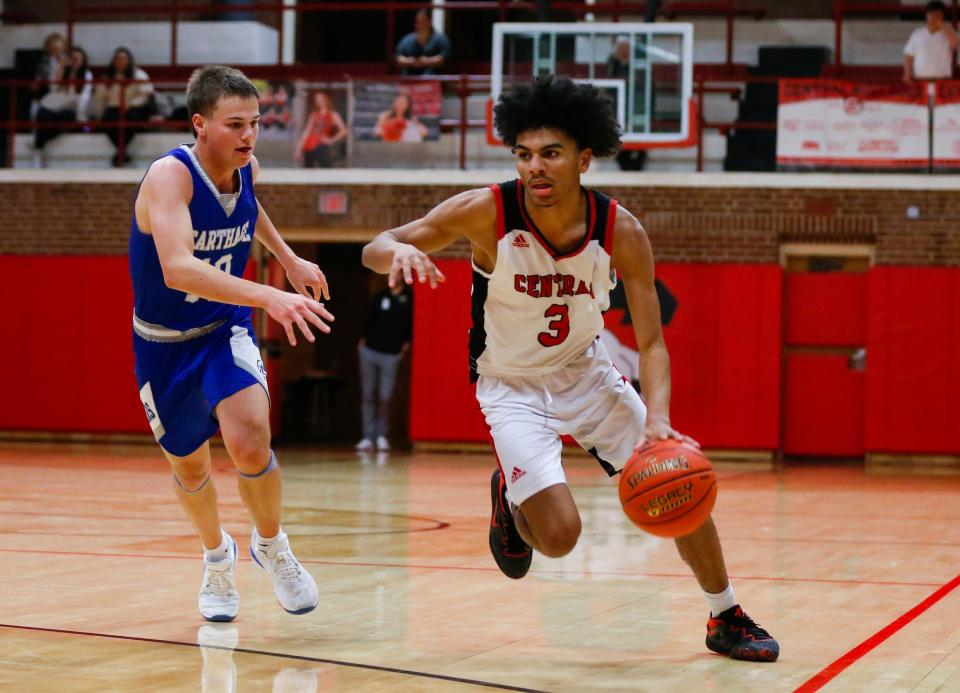Central Bulldog Sterling Vinson drives to the basket as they take on the Carthage Tigers in The Pit at Central High School on Tuesday, Dec. 13, 2022.