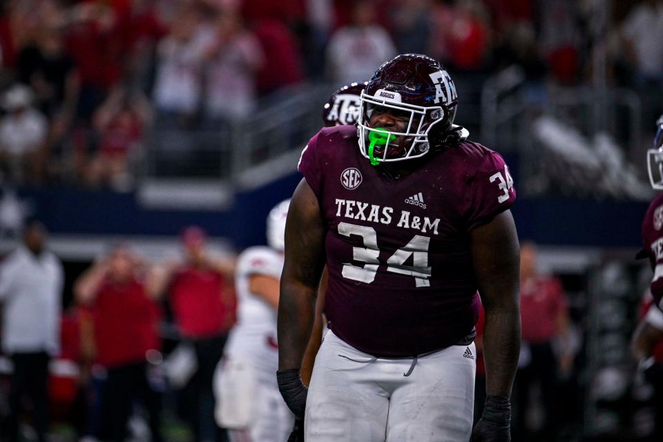 Texas A&M Aggies defensive lineman Isaiah Raikes (34) celebrates Arkansas Razorbacks missing a go ahead field goal in the fourth quarter at AT&T Stadium on Sep 24, 2022, in Arlington, Texas. Mandatory Credit: Jerome Miron-USA TODAY Sports