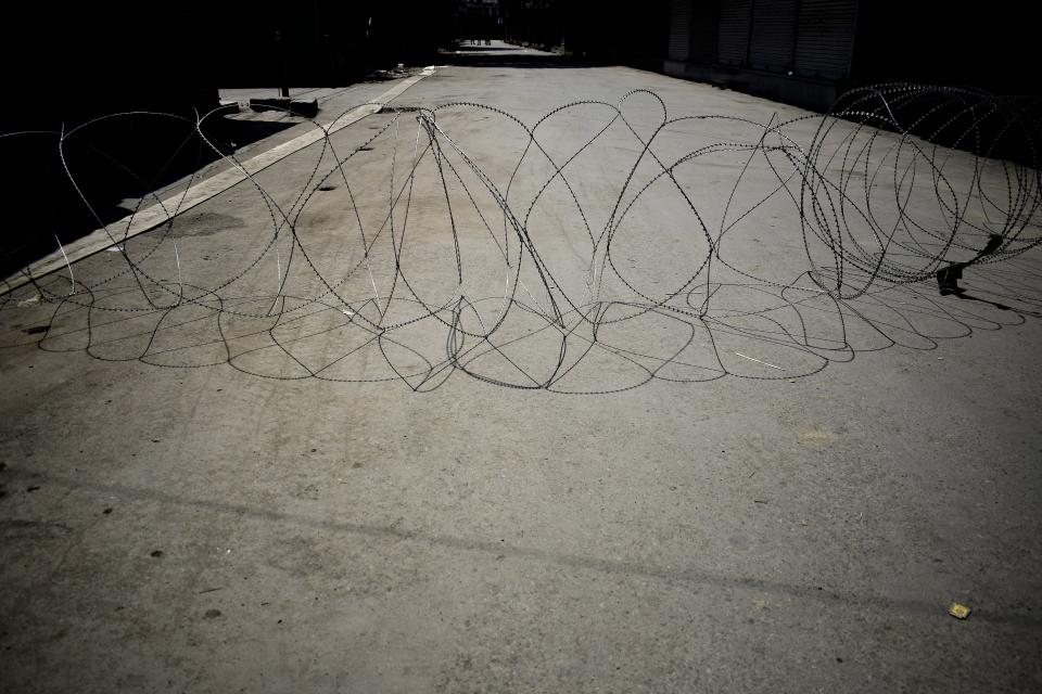 Barbed wire installed to seal roads, imposing curfew, in Srinagar, Kashmir on Aug. 6. | Sanna Irshad Mattoo for TIME