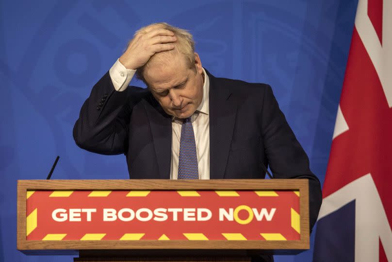 FILE - Britain's Prime Minister Boris Johnson gestures during a coronavirus media briefing in Downing Street, London, Tuesday, Jan. 4, 2022.