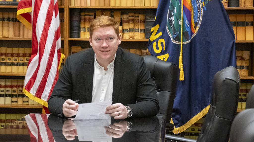 Matt Kleinmann finishes paperwork to file for office on May 20, 2024, at the Secretary of State's Office. He is running as a Democrat in the 2nd District race for an open U.S. House seat.
