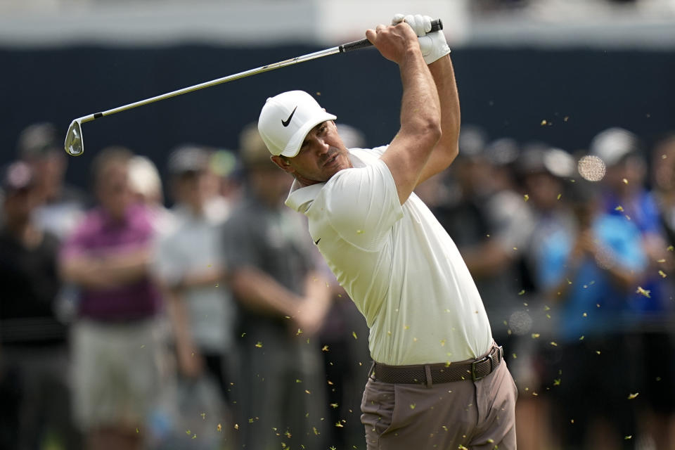 Brooks Koepka hits from the fairway on the fourth hole during the final round of the PGA Championship golf tournament at Oak Hill Country Club on Sunday, May 21, 2023, in Pittsford, N.Y. (AP Photo/Eric Gay)